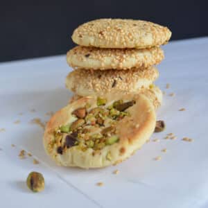 A stack of pistachio and sesame cookies.