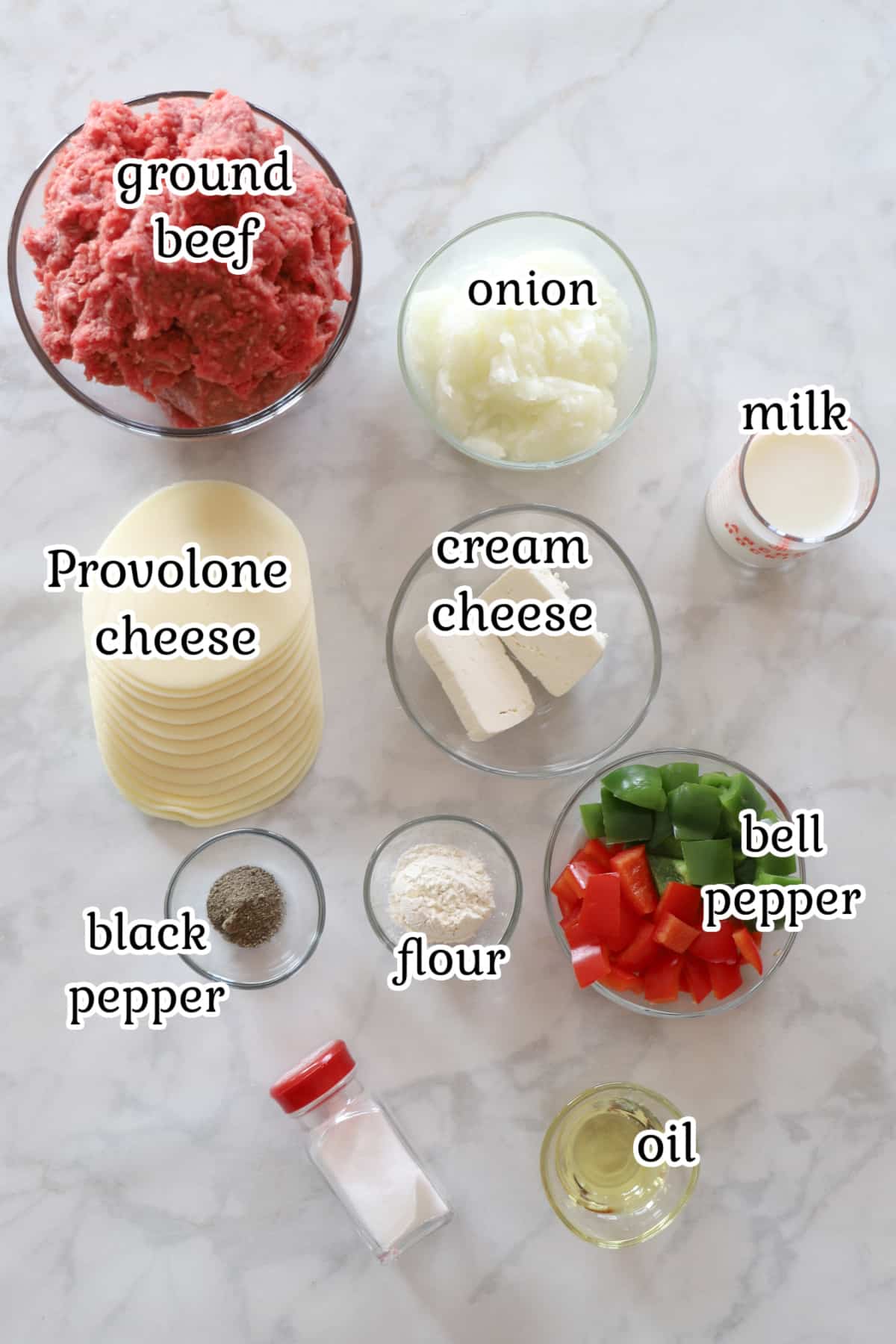 Casserole ingredients on a white surface.