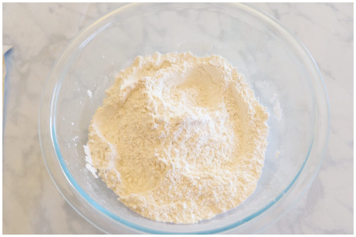 Dry ingredients mixed in a glass bowl.