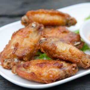 Air fryer wings on a white plate.