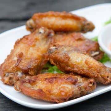 Air fryer wings on a white plate.