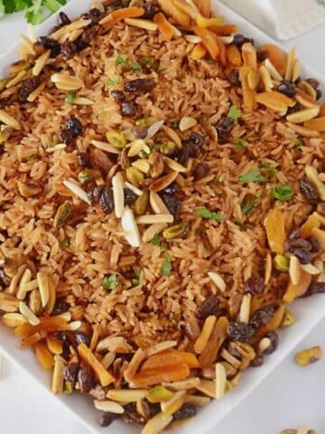 Rice pilaf 0n a serving white platter.
