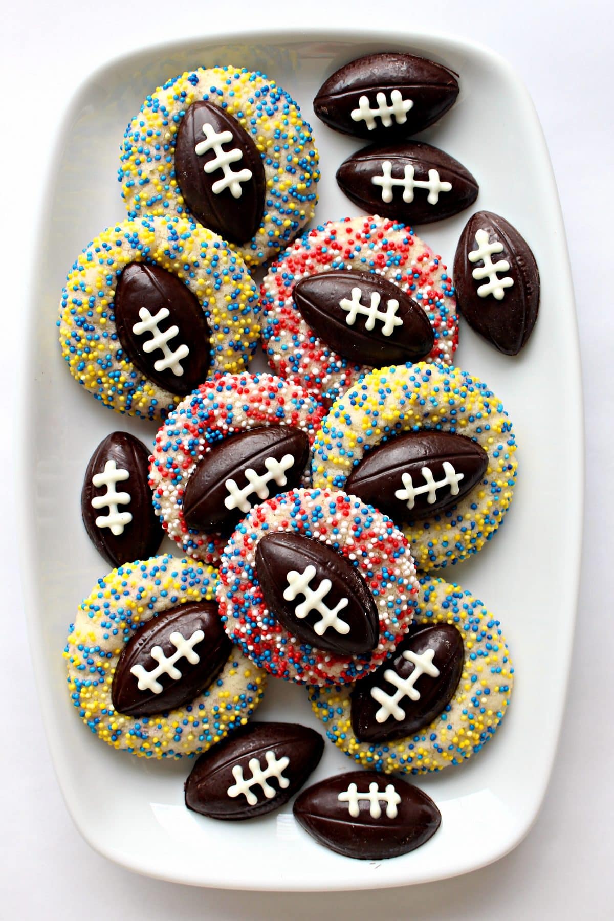 Thumbprint cookies with football chocolate in the middle.