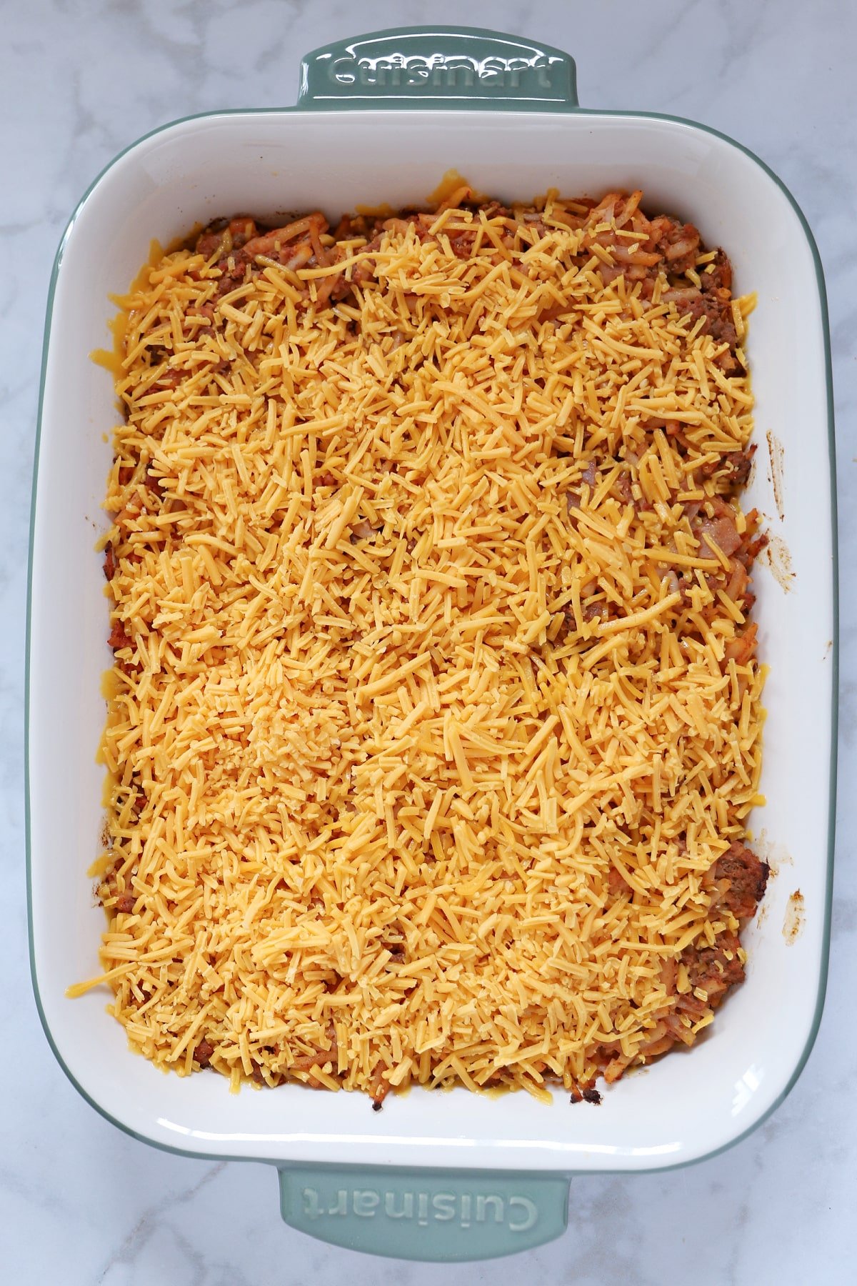 Hamburger hashbrown casserole ready to be baked.