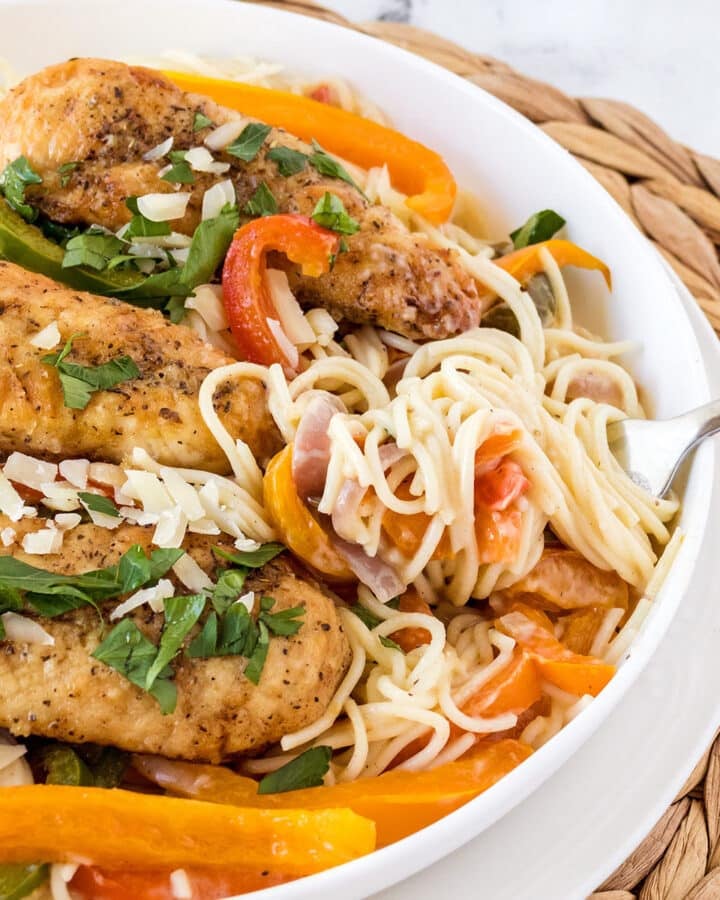 Olive garden chicken scampi with pasta on a platter.