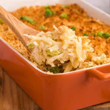 A side view of a casserole dish with creamy chicken.