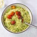 An overhead view of a plate with pesto couscous.