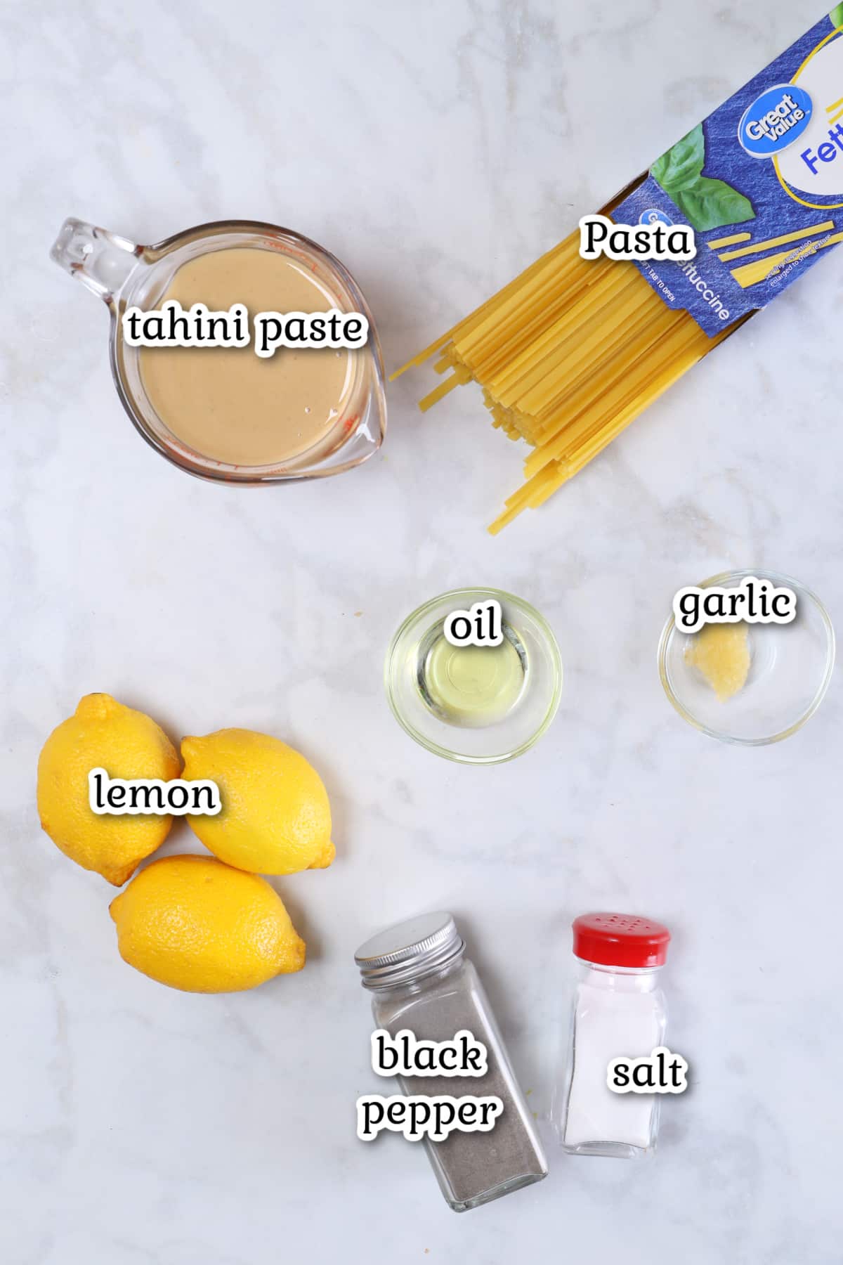 Ingredients for the recipe on a marble counter.