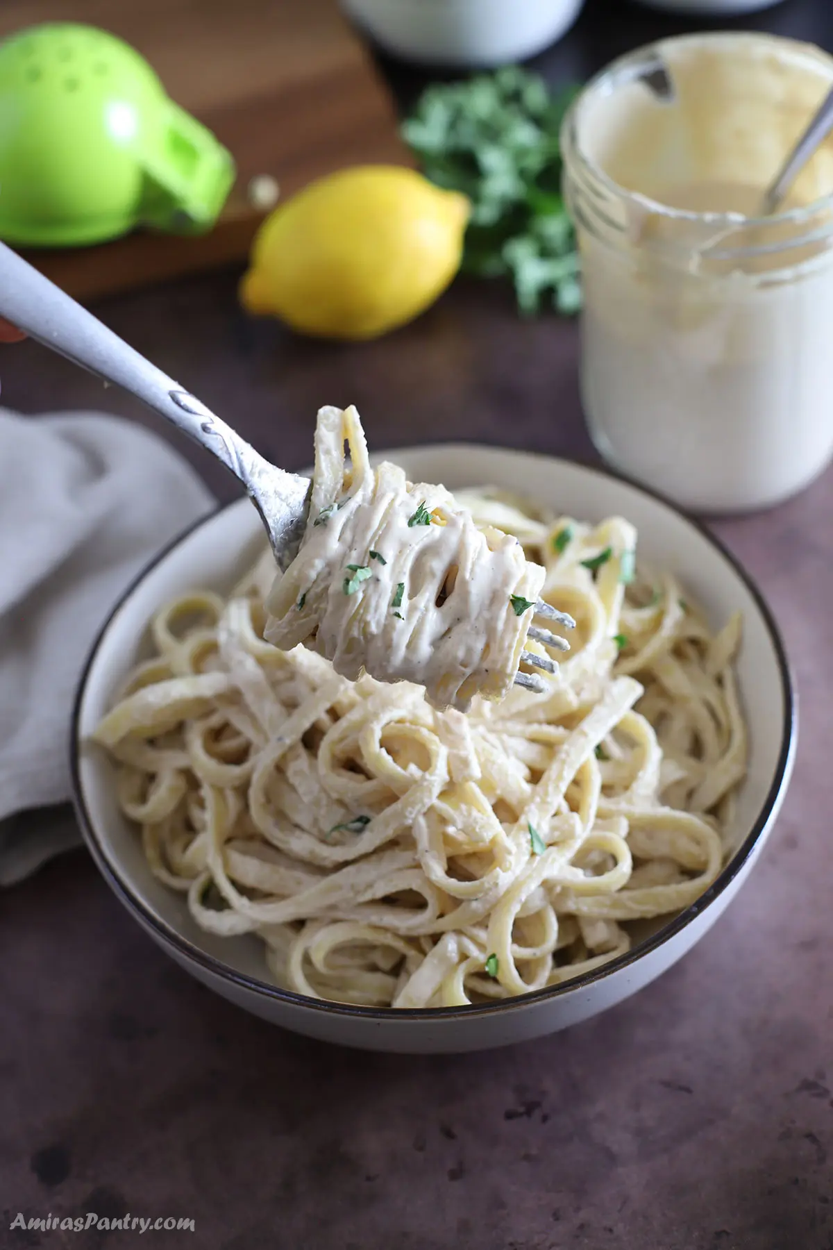 A fork with some tahini pasta.