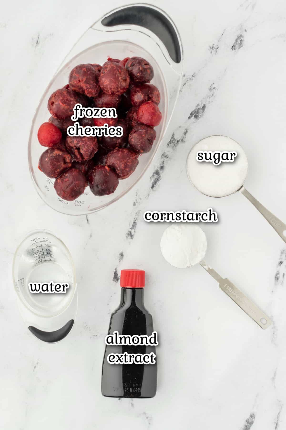 Cherry sauce ingredients on a white surface.