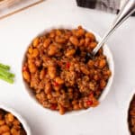 A top view of a bowl with baked beans.