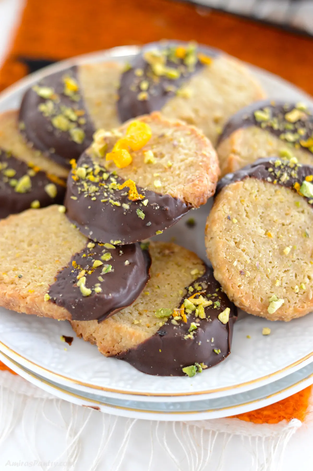 Chocolate orange cookies garnished with pistachios.
