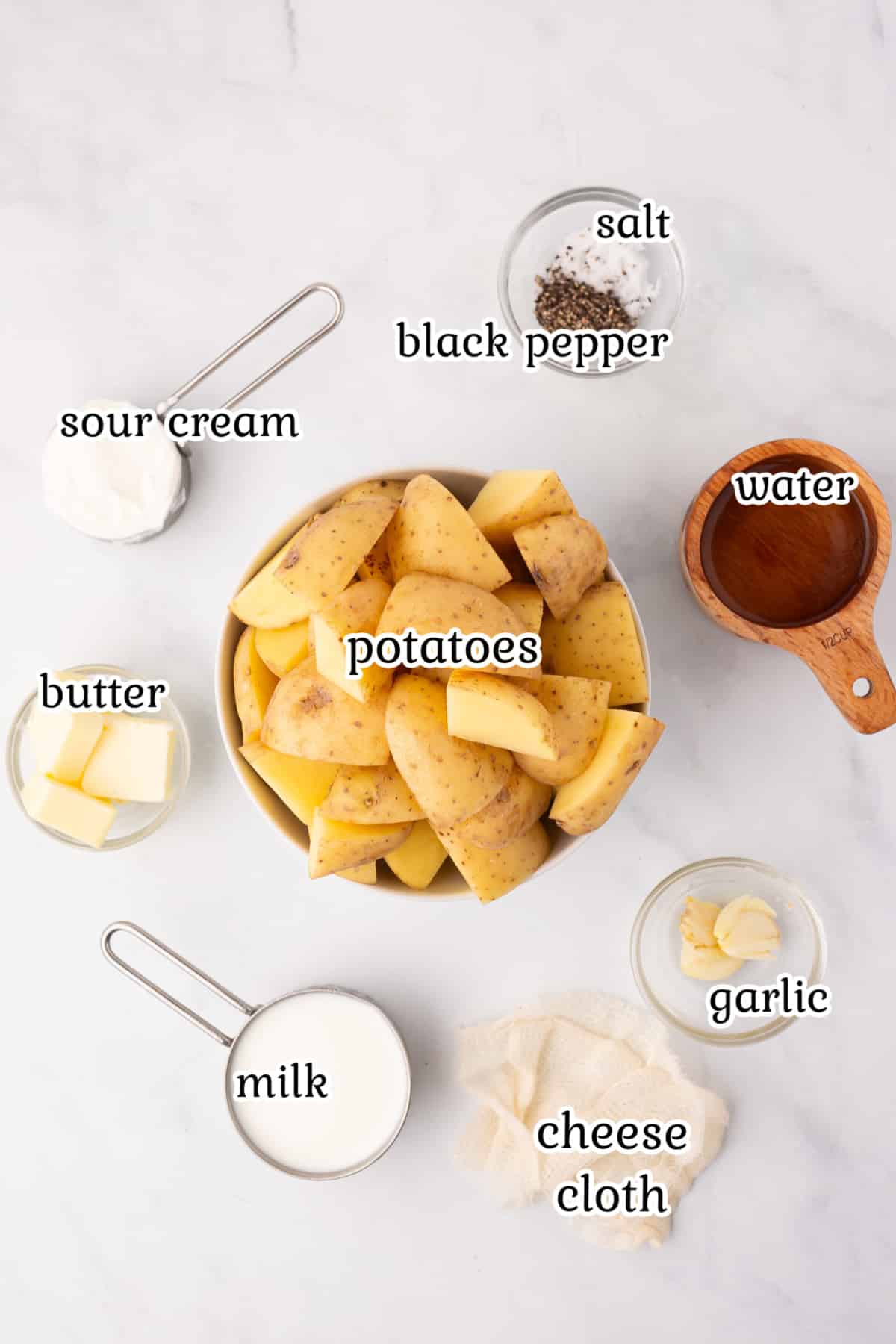 Ingredients for mashed potatoes on a counter top.