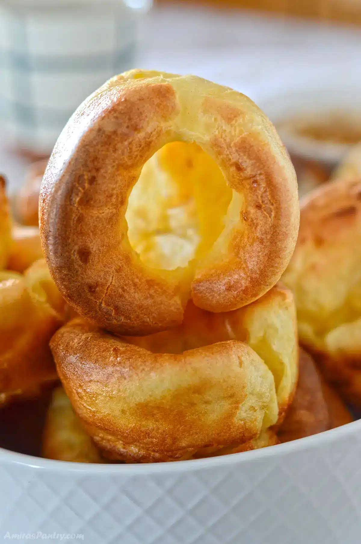 A stack of Yorkshire pudding showing a hollow one on top.