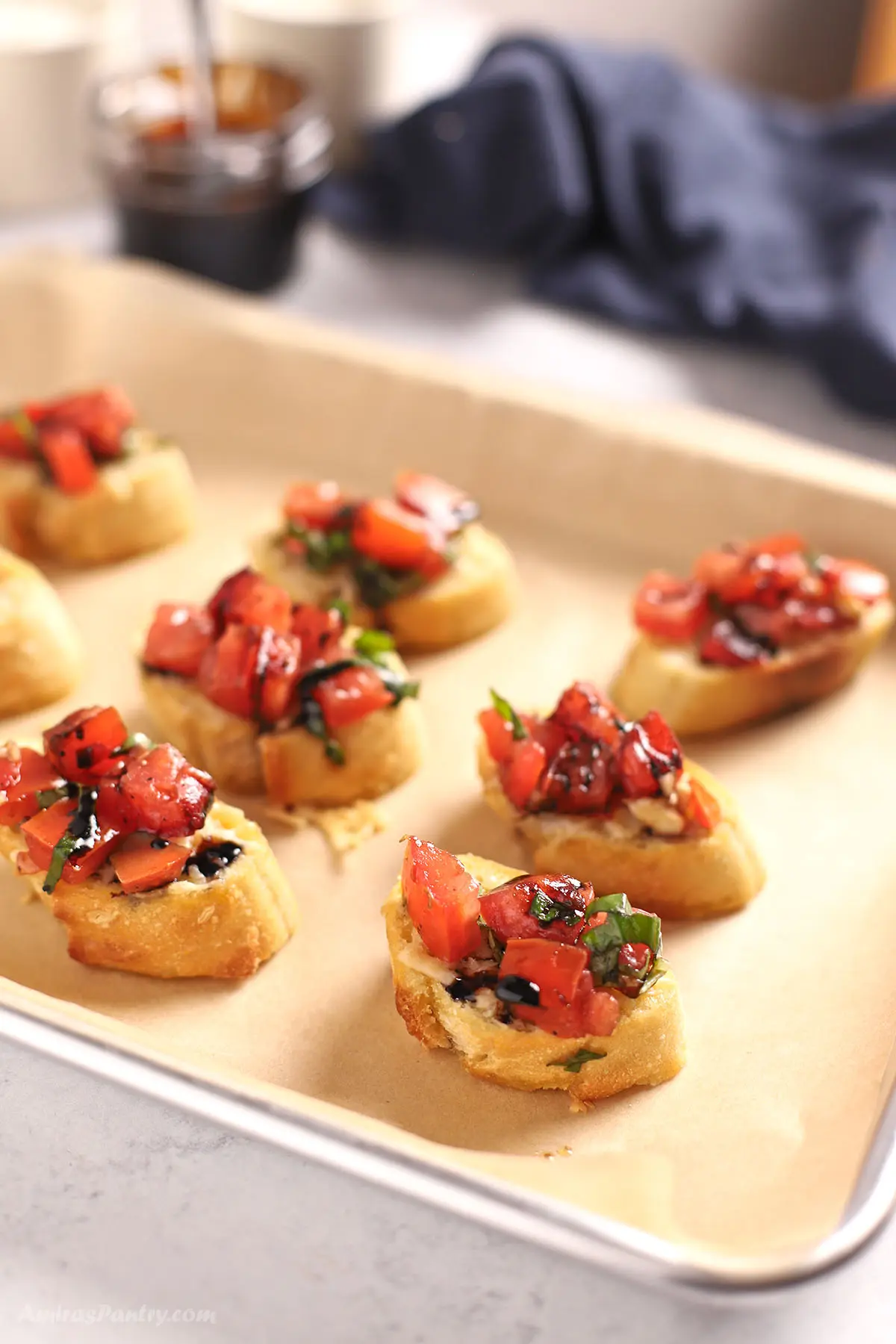 Slices of french bread topped with bruschetta.