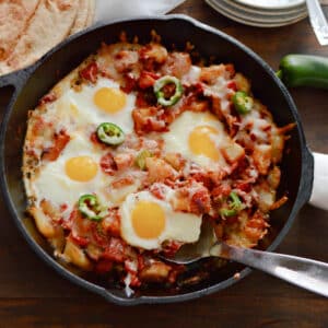 An overhead image of shakshuka in a skillet.