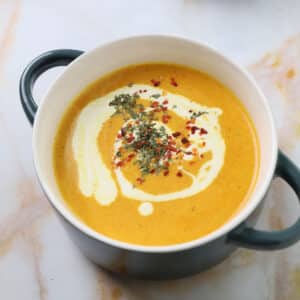 Soup bowl with carrot lentil soup.
