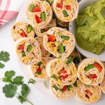 Mexican chicken pinwheels on a serving plate.
