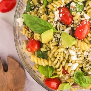 An overhead view of a bowl of pesto pasta salad.