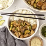 An overhead image with a rice bowl topped with some panda express chicken.