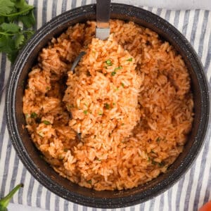 A serving spoon with Mexican rice.