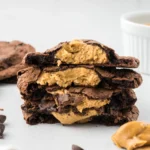 A close up image of a stack of brownie cookies.