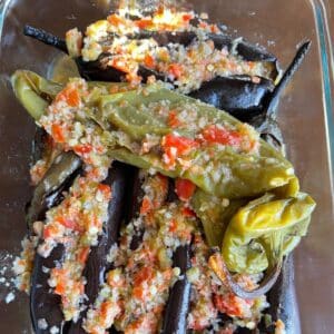 Pickled eggplants on a glass container.