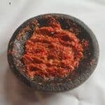 Turkish bell pepper paste in a dark bowl.