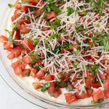 A zoom in image on a plate with bruschetta dip.