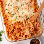 An overhead image of the pasta casserole with a wooden spoon.