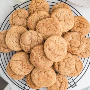 An overhead image of snickerdoodle cookies on a cooling rack.