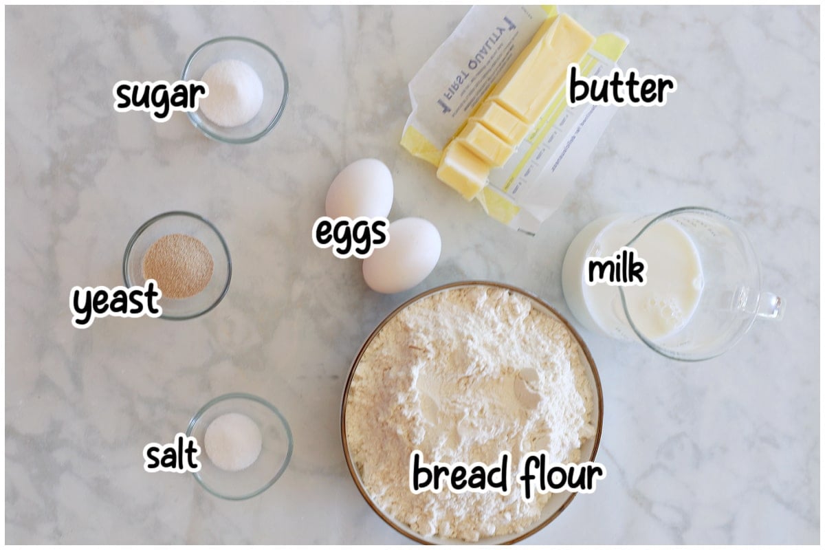 Ingredients for the rolls on a marble surface.