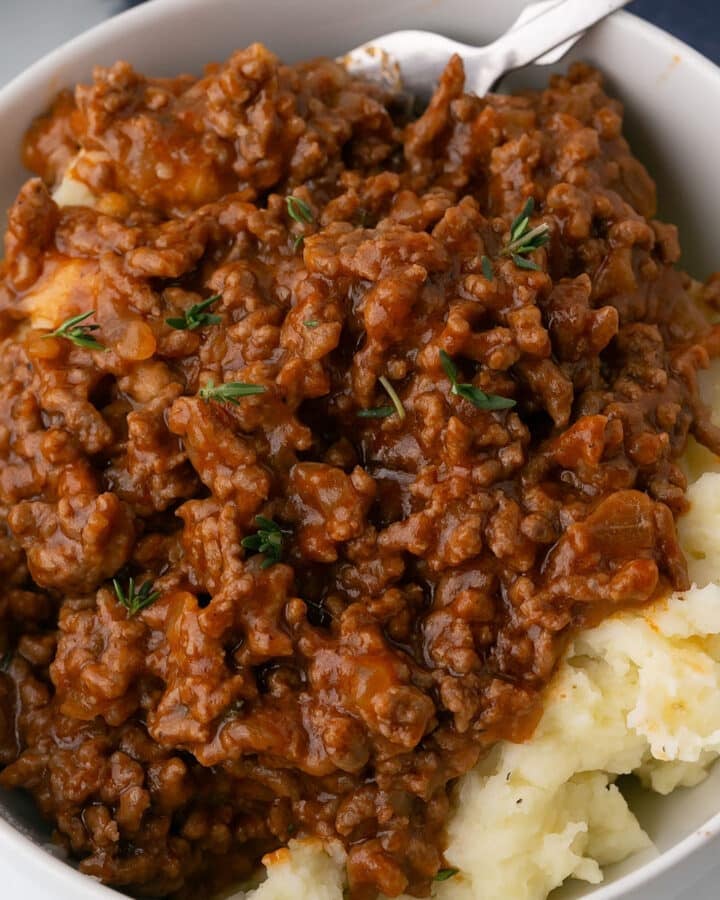 A close up image of a white bowl with the ground beef recipe.