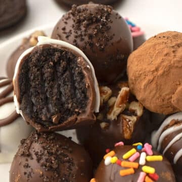 A close up image one oreo ball with a bite taken from it.