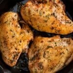 An overhead image of cooked bone in chicken breasts.