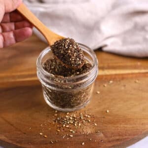 A zoomed in image on a glass jar with za'atar mix.