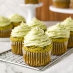 Matcha cupcakes on a cooling rack.