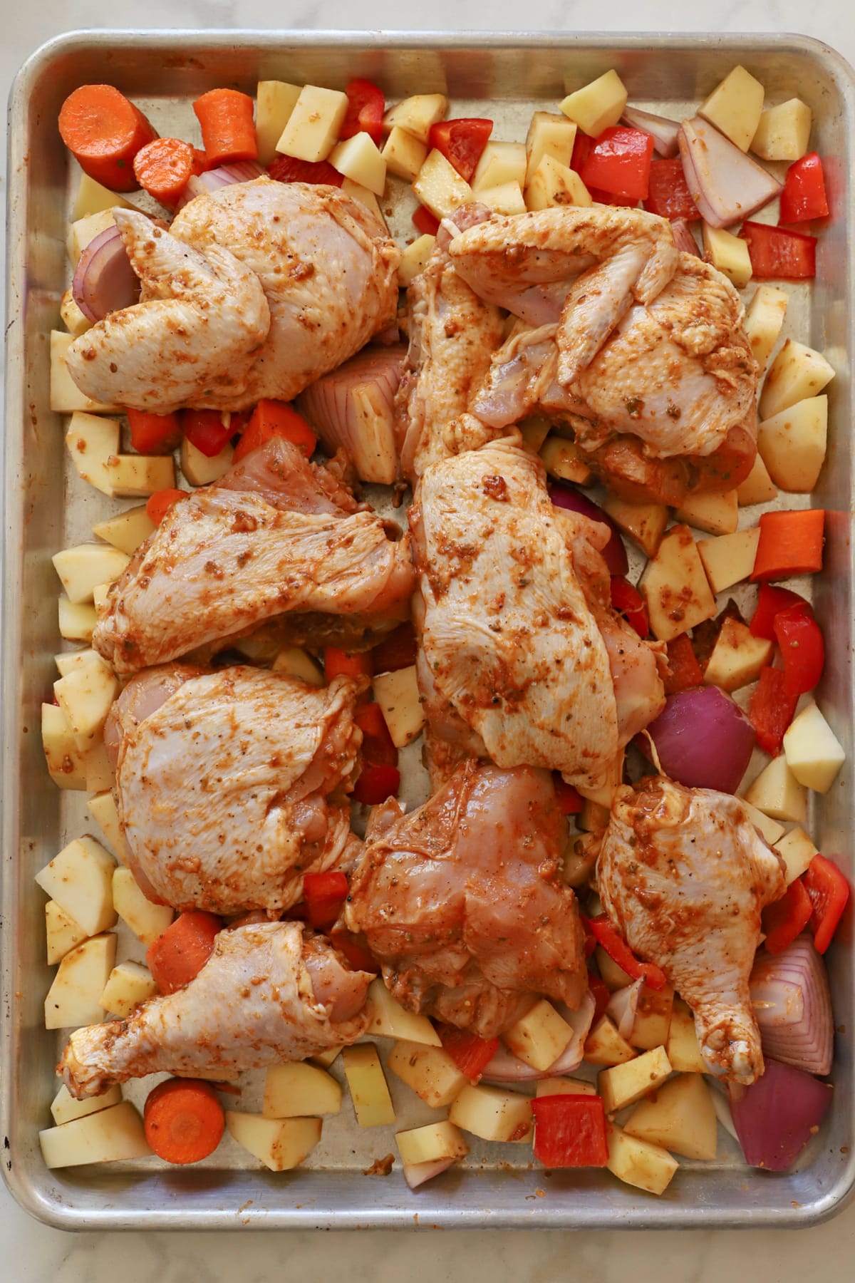 Sheet Pan chicken ready to be baked in the oven.