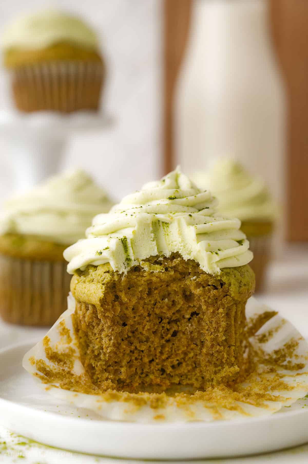 A bite taken from one cupcake to show texture.
