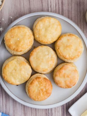 Golden biscuits on a grey serving platter.