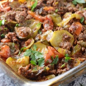 A close up image on a pyrex casserole with zucchini casserole.