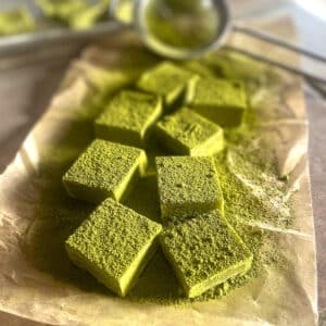 matcha on parchment paper dusted with matcha powder.
