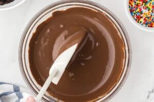 Melted chocolate in a glass bowl.