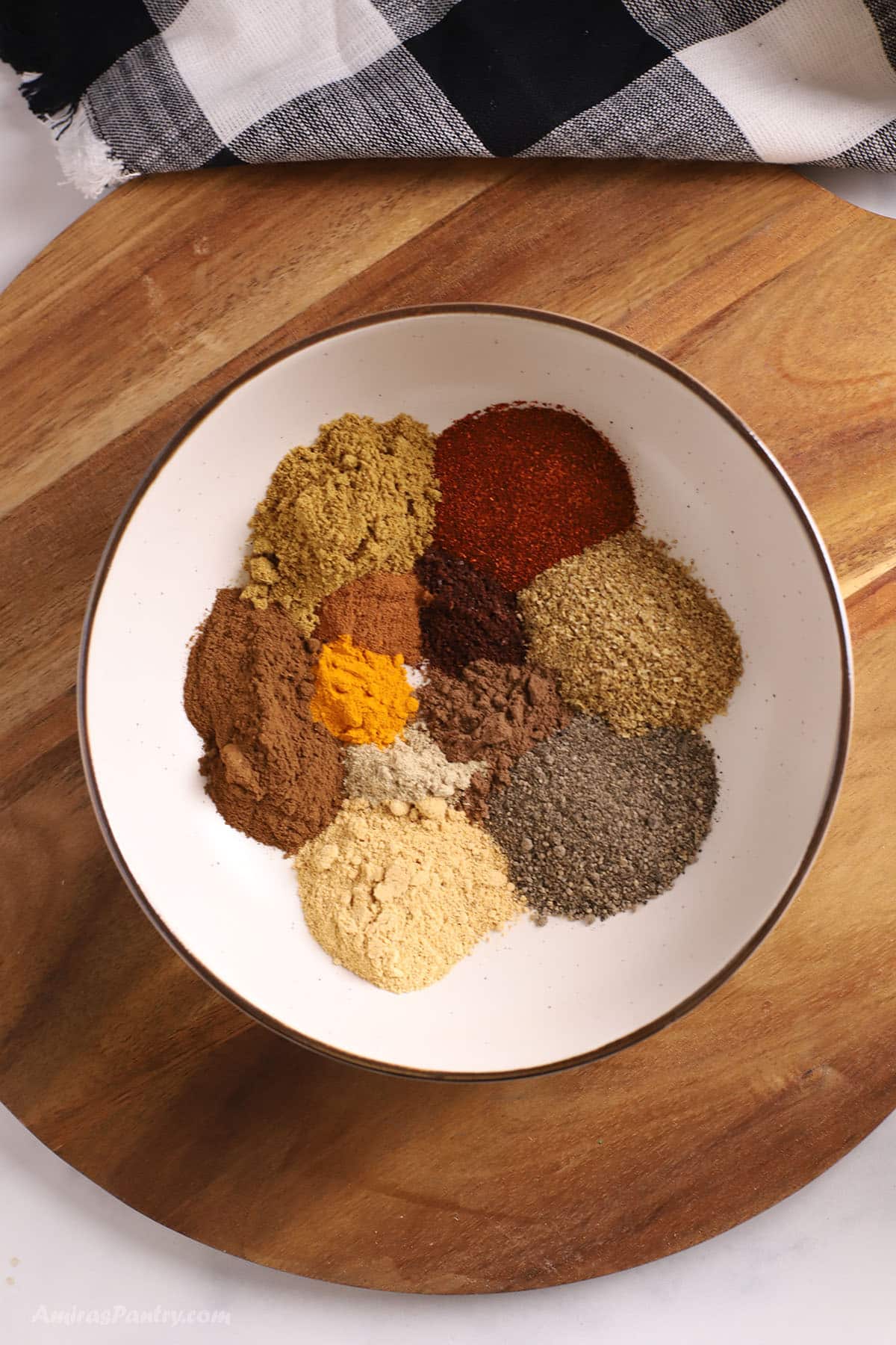 A big plate with shawarma spice mix ingredeints.