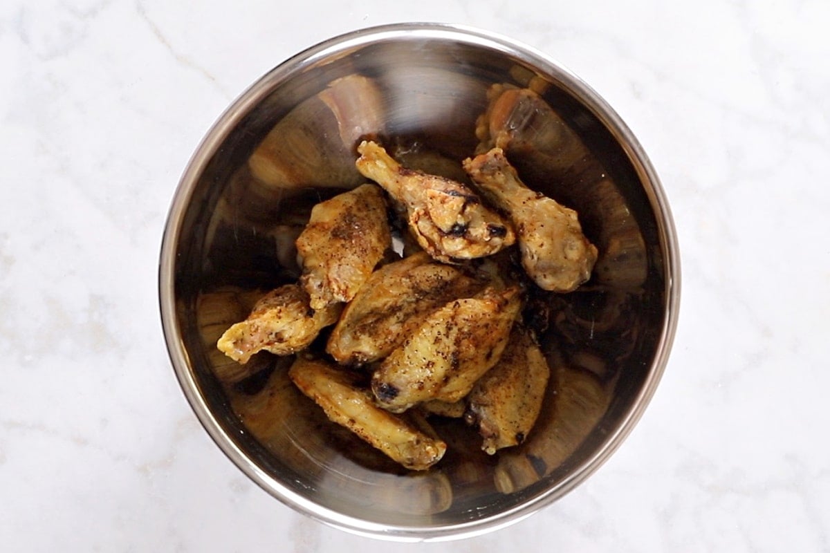 Air fried wings in a large bowl.