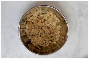 Onions with spices and breadcrumbs in a bowl.