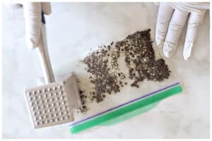 Whole peppercorn crushed in a small bag.
