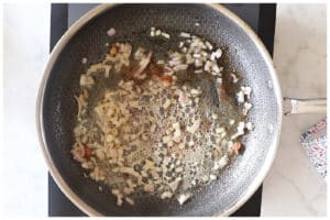 Shallots cooked in a large skillet.