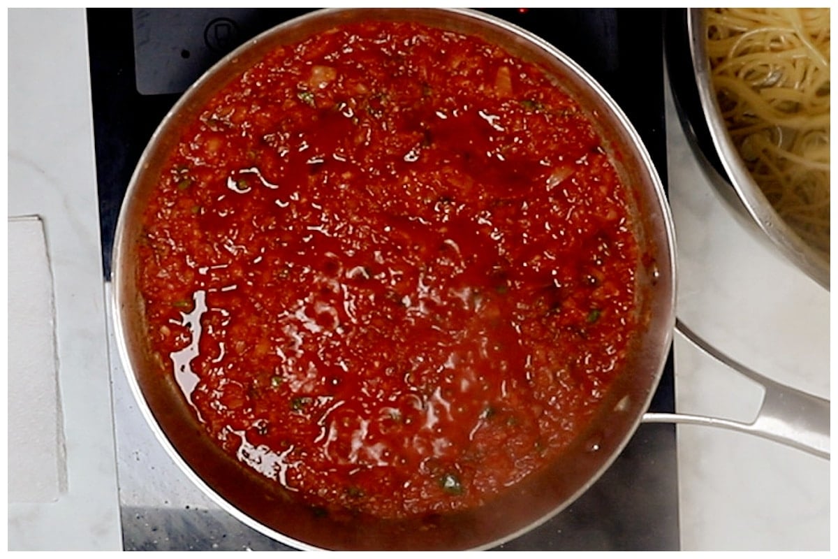 Tomato harissa sauce cooked in a skillet.