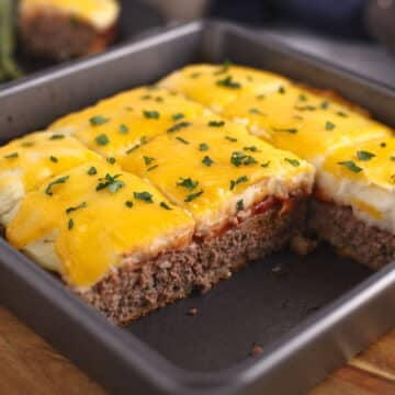 A metal pan with meatloaf casserole.